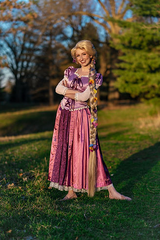 Rapunzel character with long braid in purple gown