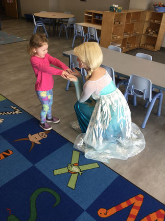 Snow Queen meeting children during a school classroom visit