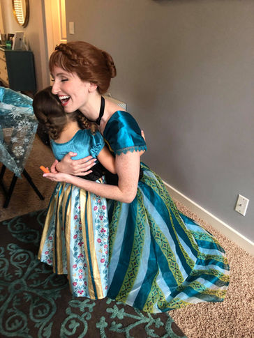 Ice Princess giving a child a warm hug